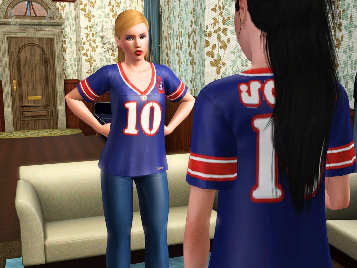 Two animated characters facing each other, one wearing a blue jersey with the number 10 and the other wearing a blue jersey with the number 11. They stand in a living room setting with patterned wallpaper and a couch in the foreground.