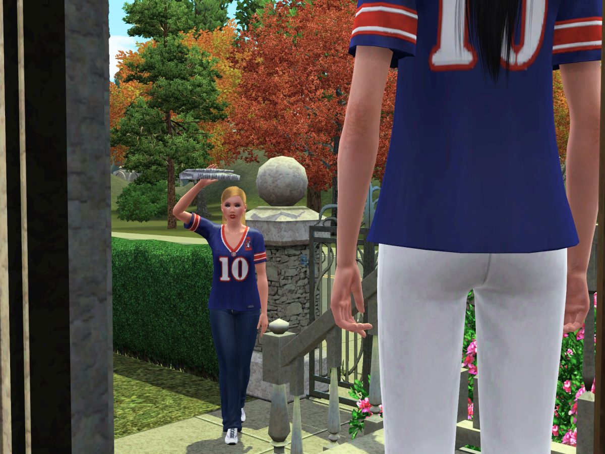 A woman wearing a sports jersey with the number 10 is walking towards another person on the stairs, holding a tray aloft. The scene features colorful trees in the background, indicating an outdoor setting.