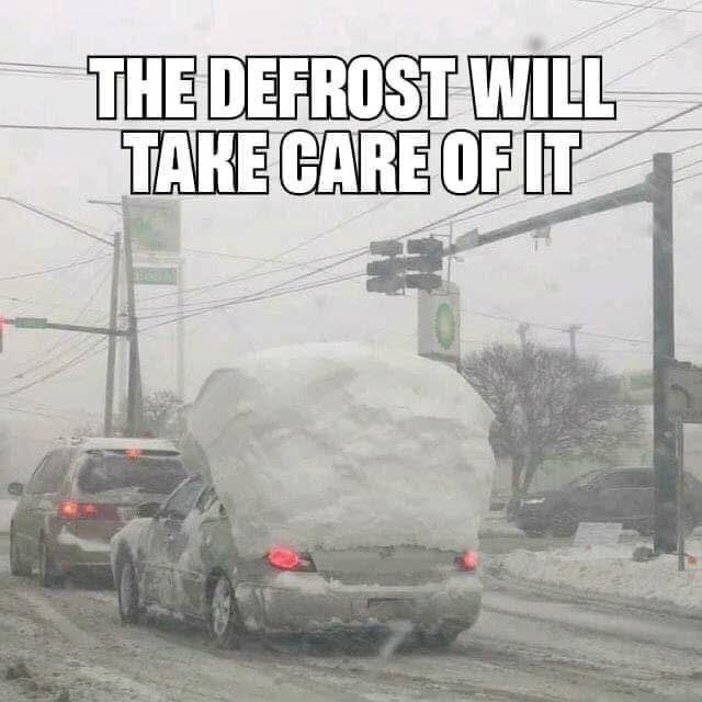 A car on a snowy road with a large mound of snow on its roof, accompanied by a humorous caption about defrosting.