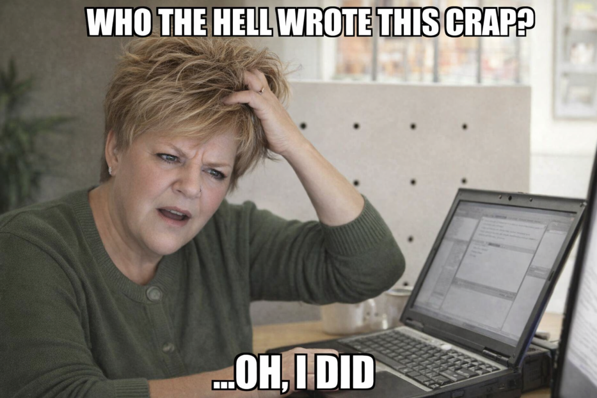 A frustrated woman in a green sweater is sitting at a desk, looking at a laptop with a confused expression. The text overlay reads 'WHO THE HELL WROTE THIS CRAP? ...OH, I DID.'