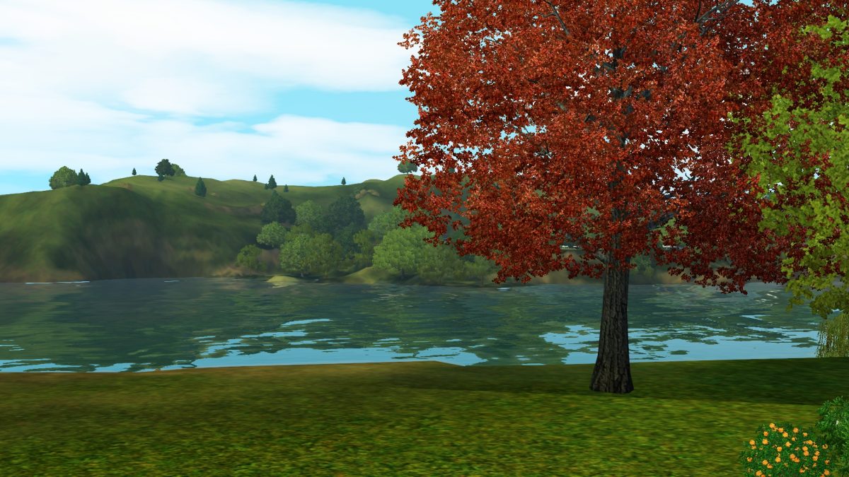 Scenic view of a lake surrounded by green hills and trees, featuring a prominent red tree in the foreground.
